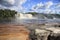 View to a powerful waterfall on a sunny bright day