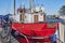 View to a red sailing boat at the Greifswald sailing harbor at the river Ryck