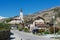 View to the residential area buildings and church from the street of Brig (Brig-Glis), Switzerland.