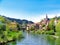 view to a river with a house beside at spring time