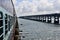 View to a road bridge from a train on the Pamban Bridge