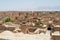 View to the roofs of the old brick buildings with badgirs wind catching towers in Yazd, Iran.