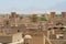 View to the roofs of the old brick buildings with badgirs (wind catching towers) in Yazd, Iran.