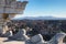 View to rooftops of Rome skyline from the Monument of Vittorio Emanuele at Piazza Venezia. Colosseum in the background