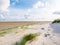 View to sand flats of Wadden Sea at low tide from beach of nature reserve Boschplaat on island Terschelling, Netherlands