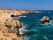 View to sea cave and stone cliffs near Lovers bridge