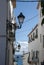 View to the sea in lane with typical white spanish houses in Altea, Costa Blanca