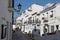 View to the sea in lane with typical white spanish houses in Altea, Costa Blanca