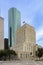 view to skyline of Houston with historic city hall and wells fargo square and skyscraper seen from Hermans park square, Houston