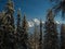 View to the snow-covered Piz Lischana mountain group through the