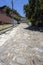 View to steep cobblestone street with houses in historical town São Luà­z do Paraitinga, Brazil