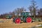 View to tractors and machines that are ready to prepare an asparagus field in Germany for cultivation