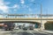 view to train station Baldwin heights in Los Angeles at a bridge and casrs passing the line underneath