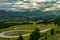 View to the valley with emphasis on the `Cuesta del diablo` road. Beautiful view of the valley, trees and hills