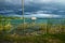 View to village with dock along the lake shore with birds, El Remate, Peten, Guatemala