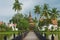 View to the Wat Traphang Thong with the bridge over a pond at the foreground in Sukhothai, Thailand.