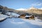 View to a winter landscape with old farmhouse and mountain range, Gasteinertal valley near Bad Gastein, Pongau Alps - Salzburg Aus