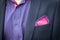 View to the young man\'s shirt and coat with a pocket a reddish-purple square. Men\'s suit accessories. Wedding male guest\'s atti