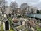 View of tombs in Montmartre Cemetery looking toward overpass on rue Caulaincourt, Paris, France
