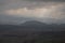 View of Tona Castle against the backdrop of the cloudy sky and hills. Catalonia, Spain