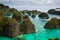 View from the top of the cliff at remote archipelago Pulau Wayag, Raja Ampat, Indonesia