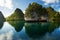 View from the top of the cliff at remote archipelago Pulau Wayag, Raja Ampat, Indonesia