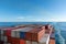 View on the top of containers loaded on deck of the large cargo ship.