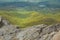 View from the top of Little Stony Man mountain in Shenandoah National Park on a foggy spring day. Focus on the rocks in foreground