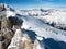 View from the top of the marmolada to skiers, who  start their run down to the valley