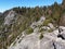 View from the Top of Moro Rock with its solid rock texture, overlooking mountains and valleys - Sequoia National Park