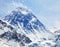 View of top of Mount Everest with clouds and snowfall