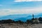 View from top Mount Washington across mountainous landscape to horizon