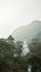 The view on top of the mountain Adam`s Peak on sunset buddha temple. Sri Lanka