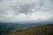 A view from the top of the mountain Gemba or Gimba down to the meadow and village Pilipec, Carpathian mountains, Ukraine