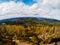 View from the top of the mountain to the autumn Vosges mountains in Alsace. Autumn colors and amazing space and freedom around