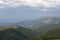 View from top of the mountain to stunning sky and more mountains