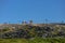 View at the top of the mountains of the Serra da Estrela natural park, tower buildings with dome and cable car railway circuit,