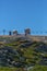 View at the top of the mountains of the Serra da Estrela natural park, tower buildings with dome and cable car railway circuit,