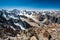 View from the top of Pik Uchitel peak with cross. Ala Archa Alpine National Park Landscape near Bishkek, Tian Shan Mountain Range