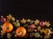 The view from the top of the pumpkin, chestnut, autumn leaves and apple on dark brown wooden background