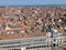 A view from the top of St Marks Campanile of St Marks Square looking down on the square with tourists below and the amazing city
