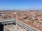 A view from the top of St Marks Campanile of St Marks Square looking down on the square with tourists below and the amazing city