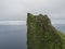 View on top of steep king and queen Hornbjarg bird cliff in west