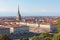 View of Torino Turin, Italy city center with landmark of Mole Antonelliana towering over the city.