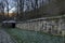 View toward inner courtyard, wall, main exit and small corner with sacred spring sourcein in Demir Baba Teke, cult monument