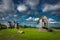 View towards Collection of old windmills at Angla Windmill Hill on a sunny day with blue sky and clouds in Saaremaa