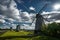 View towards Collection of old windmills at Angla Windmill Hill on a sunny day with blue sky and clouds in Saaremaa