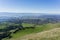 View towards Fremont from the trail to Mission Peak, cattle grazing on the hills, east San Francisco bay, California