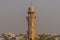 A view towards a minaret over the roof tops of Jaipur, Rajasthan, India in the morning