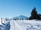 View towards mount Rigi, a famous peak in Switzerland, along a snow covered winter hiking trail.